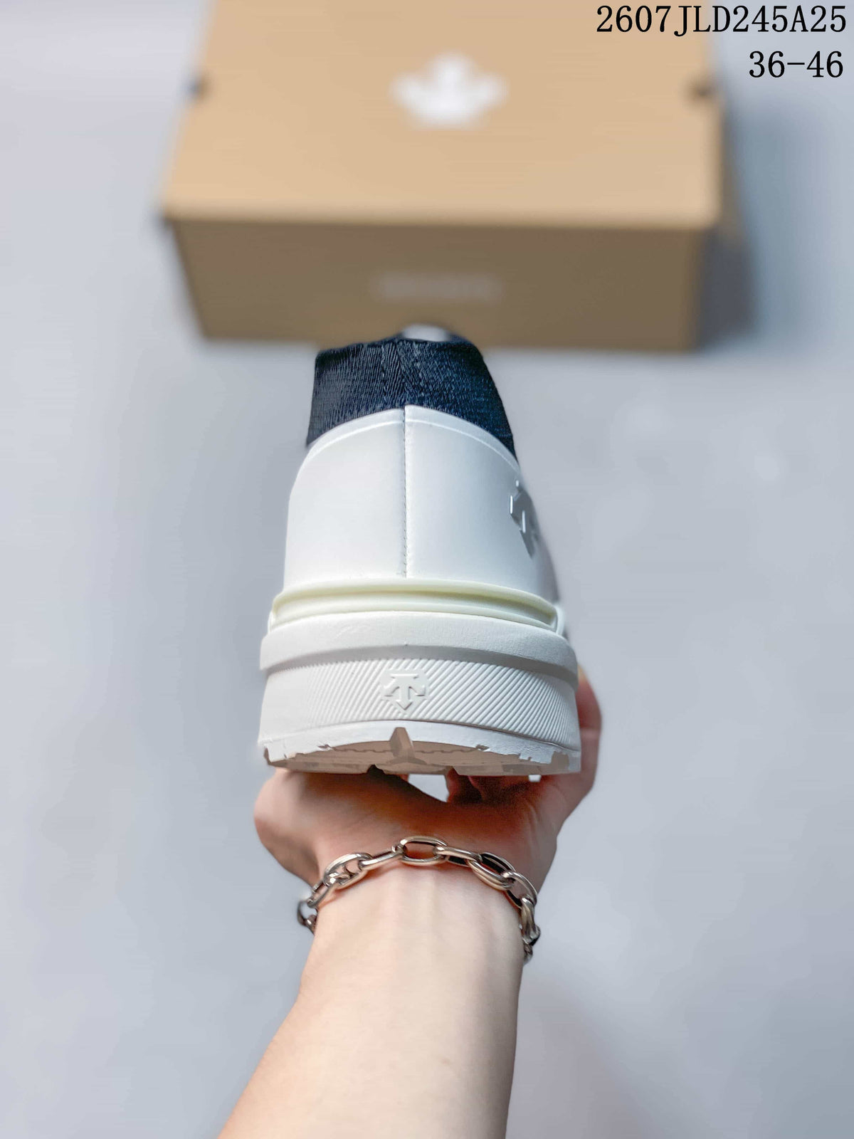 Rear view of the white sneaker showing the padded heel, layered sole, and heel branding detail.