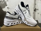 Angled view of white On Running sneakers with textured uppers and chunky soles