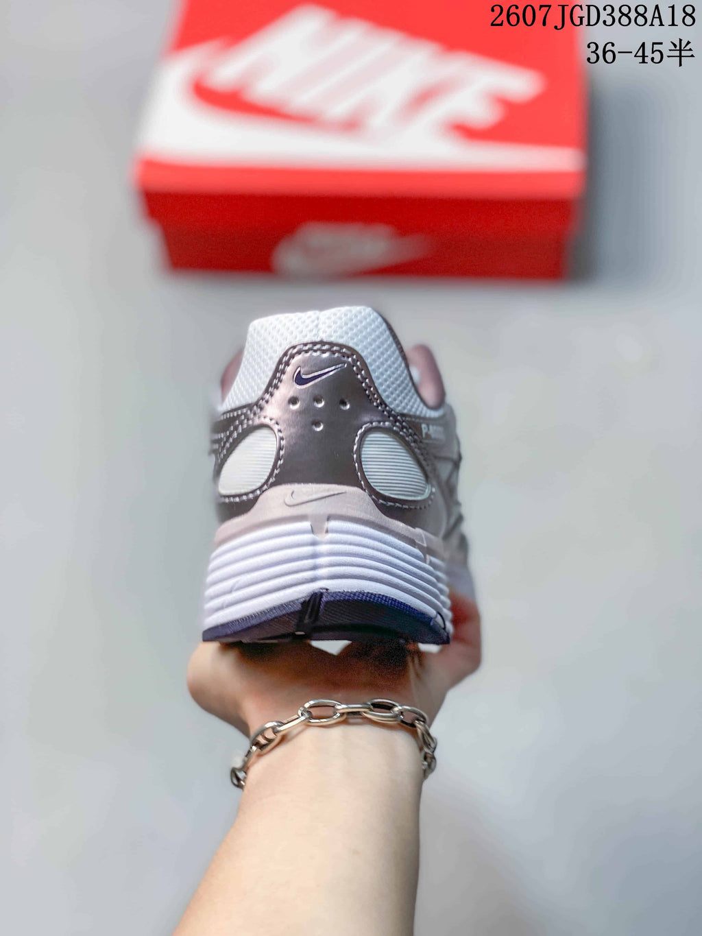 Rear view of a Nike P-6000 sneaker showing the padded heel collar, layered heel panels and textured outsole.