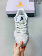 Top view of the basketball shoe showing the speckled mesh toe area, flat laces, and tongue branding.