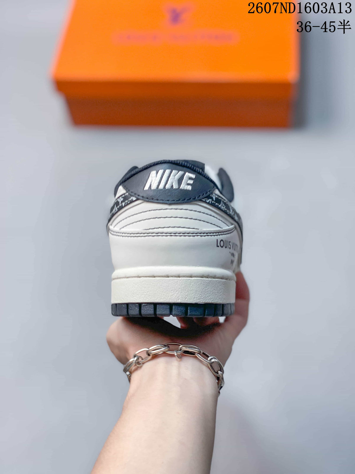 Rear view of the sneaker showing Nike branding, white heel construction, and dark outsole edge.