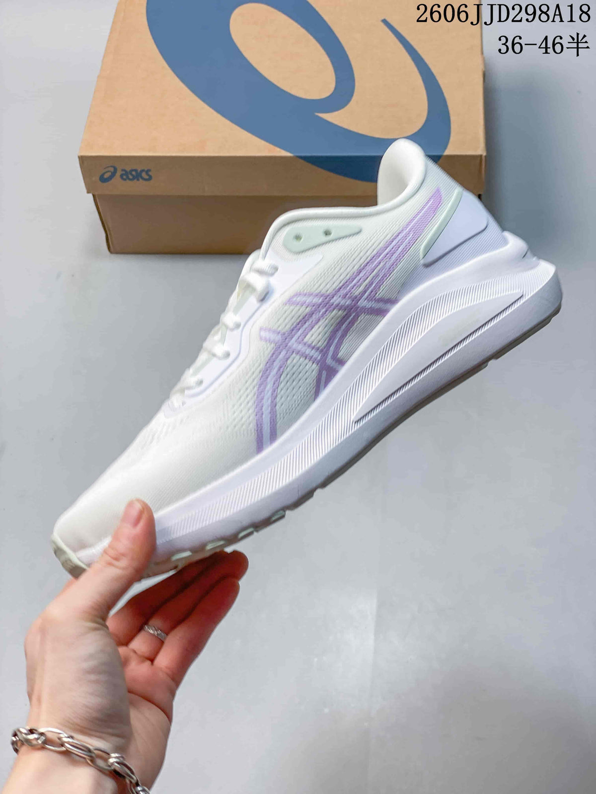 Side profile of the white and lilac ASICS GT-1000 13 running shoe with visible overlays and textured sole.