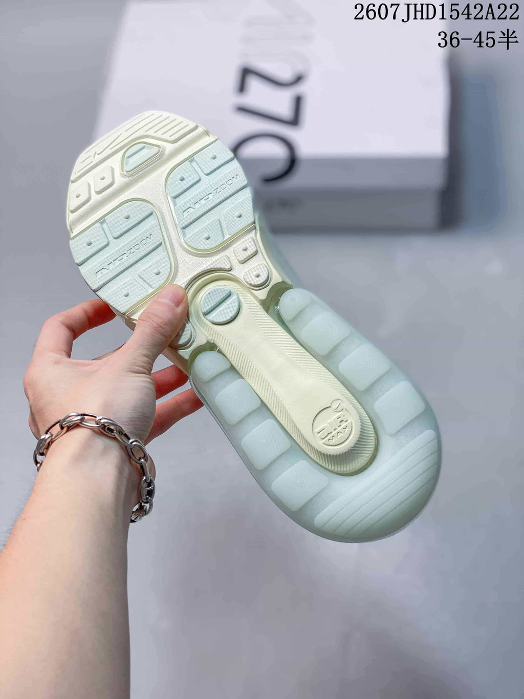 Outsole view showing the segmented sole pattern and Air Max branding on a pale mint green sneaker.