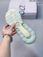 Outsole view showing the segmented sole pattern and Air Max branding on a pale mint green sneaker.