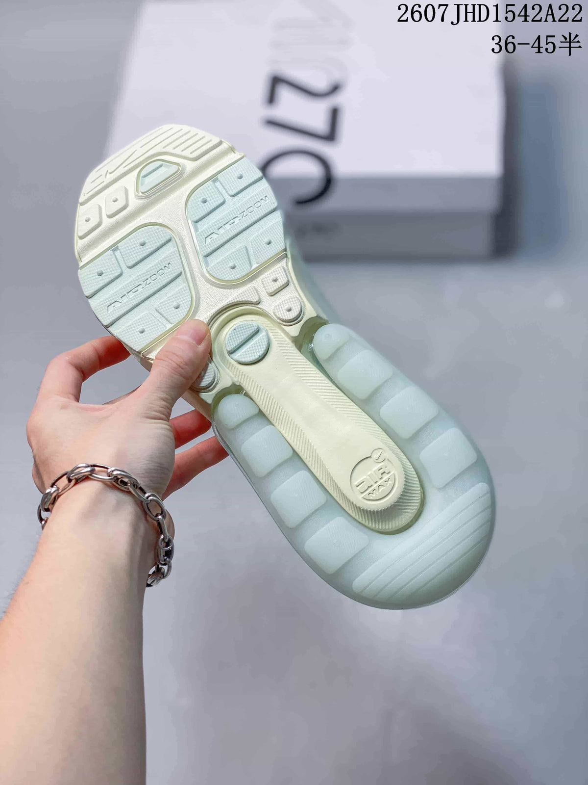 Outsole view showing the segmented sole pattern and Air Max branding on a pale mint green sneaker.