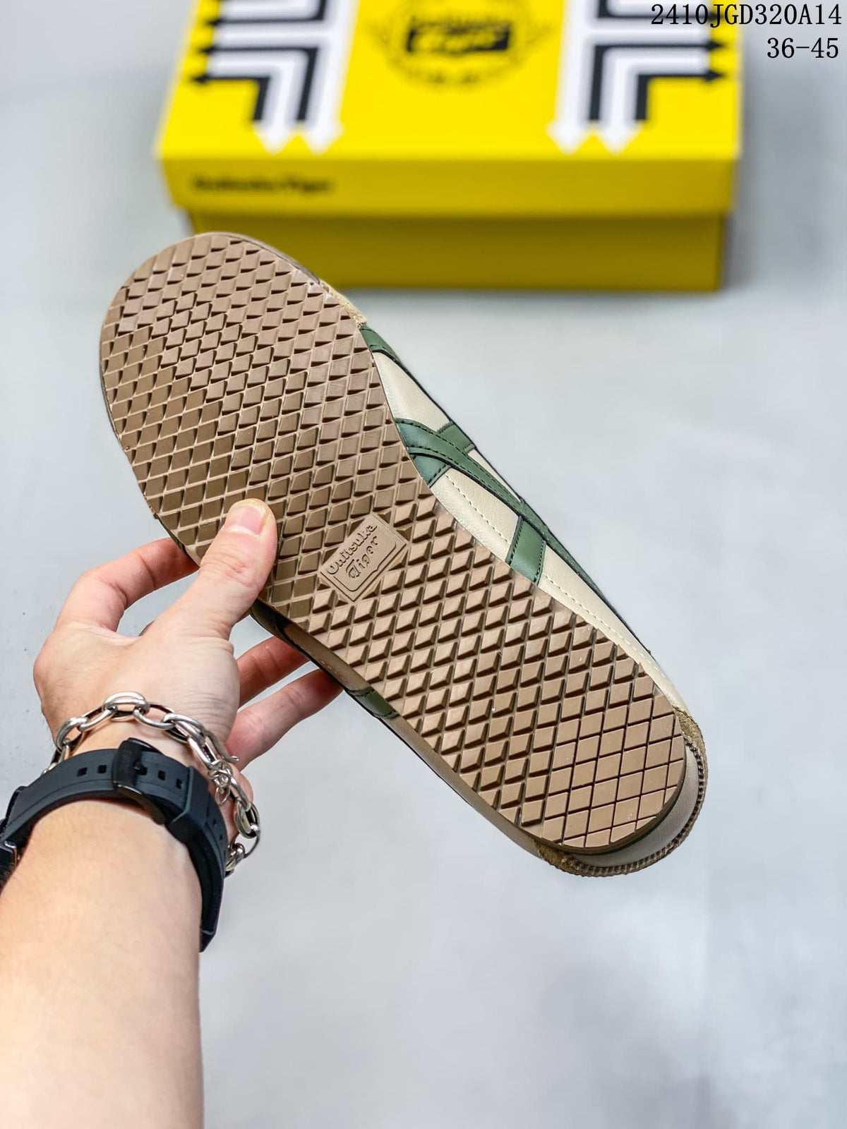 Bottom view of an Onitsuka Tiger sneaker showing the textured outsole with a repeating diamond tread pattern.