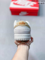 Rear view highlighting the padded heel area and light gold detailing.
