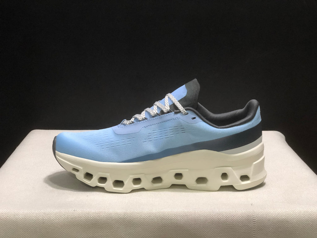 Side profile of one light blue sneaker showing the layered upper and thick white sole.