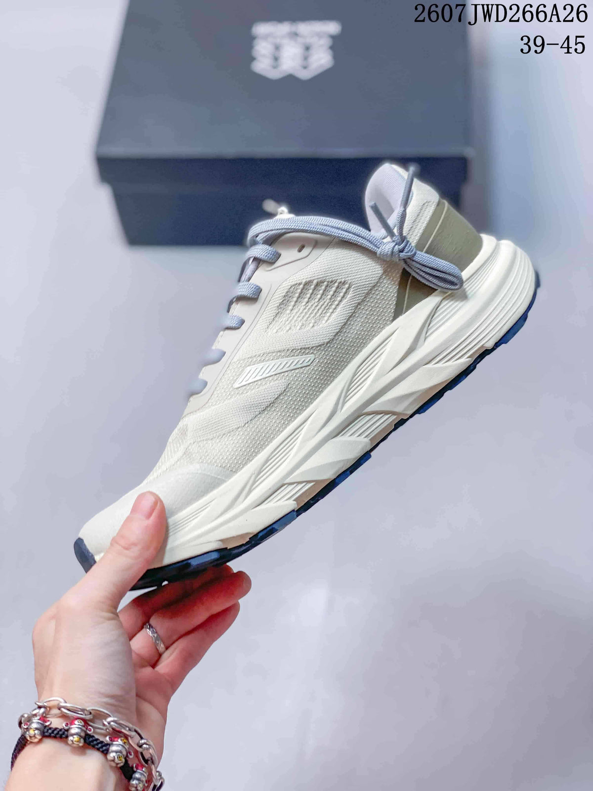 Side profile of an off-white KOLON SPORT KRUST shoe showing the textured upper, layered panels, sculpted midsole, and navy outsole.