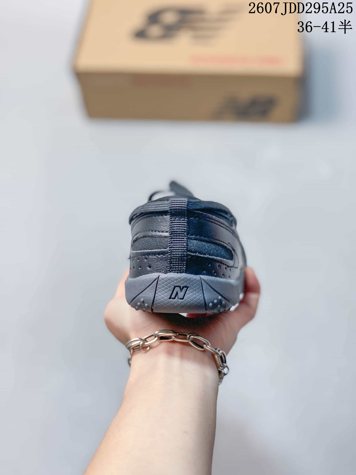 Rear view of the sneaker showing the padded heel, gray outsole, and New Balance branding detail.