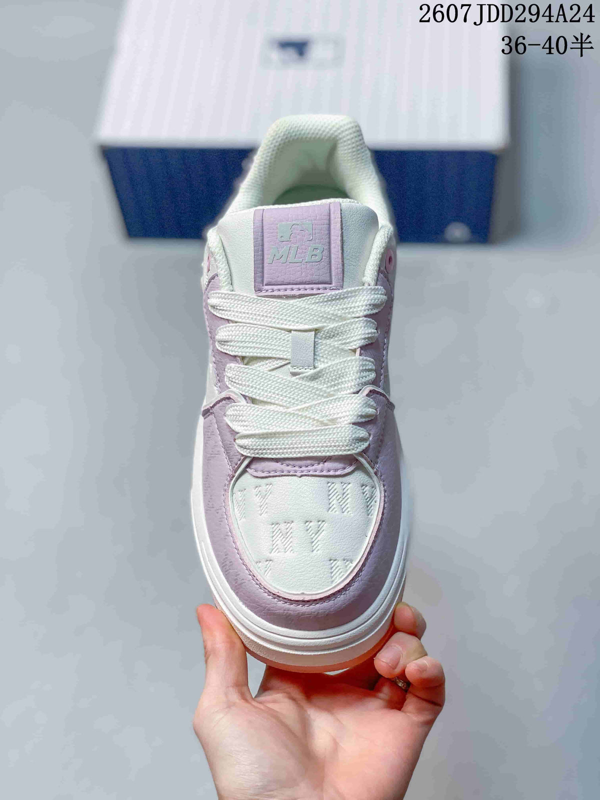 Top view showing the white laces, lavender tongue label, padded collar, and patterned toe panel.