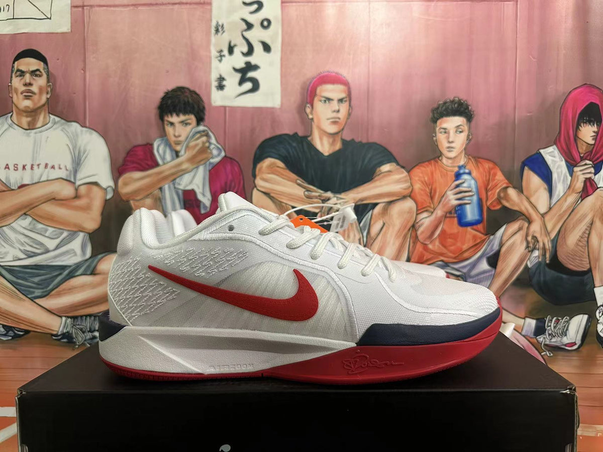 Side view of a white Nike basketball shoe with a red Swoosh, dark midsole detail, and red outsole.