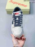Top view showing the perforated white toe box, dark patterned laces and tongue label.
