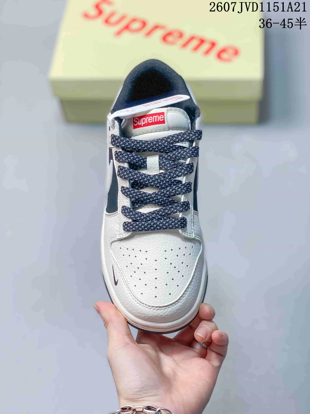 Top view showing the perforated white toe box, dark patterned laces and tongue label.