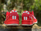 Rear view of red Nike Kobe 8 shoes with white heel accents