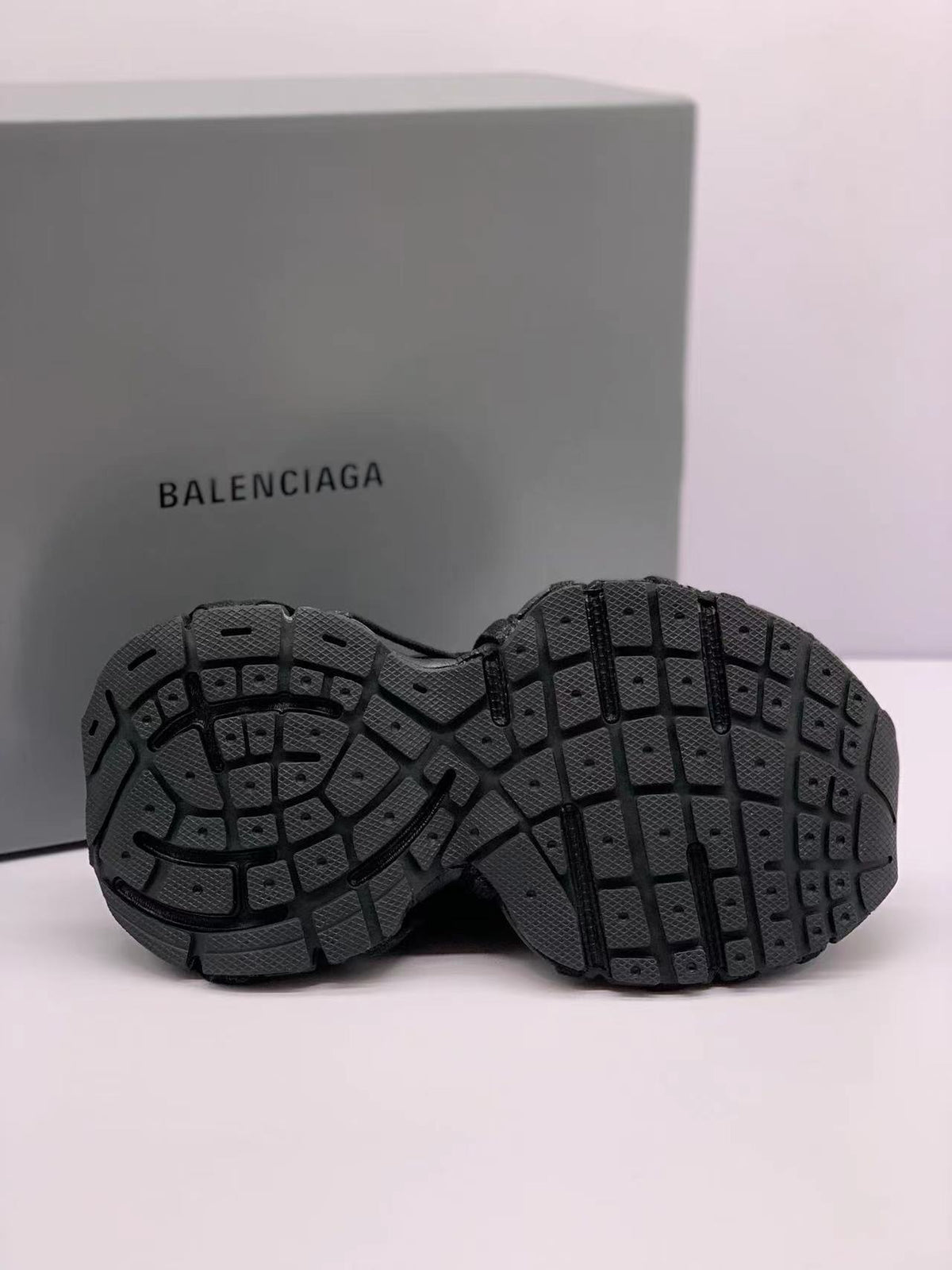 Underside view showing the segmented black outsole and patterned tread.
