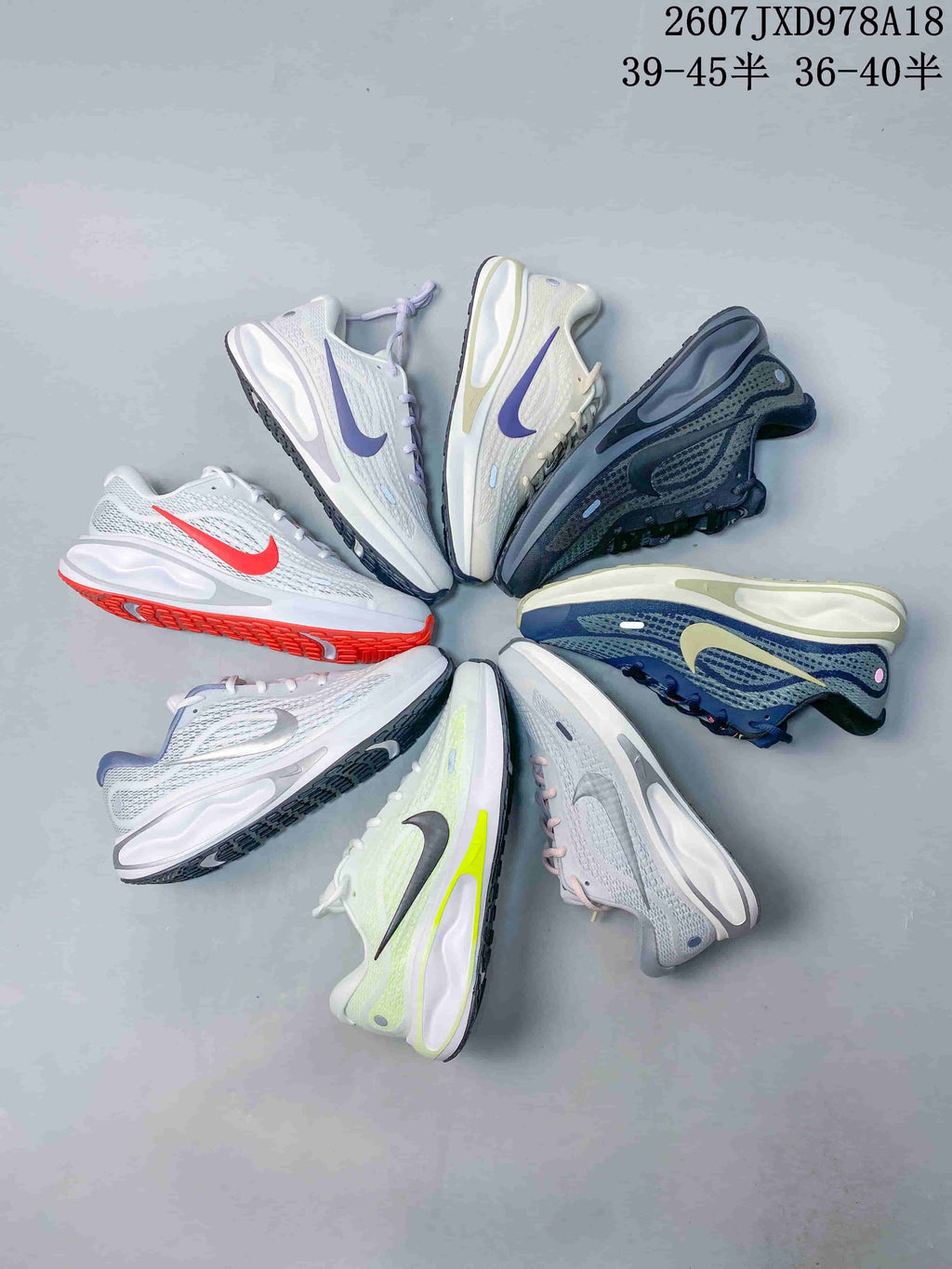 Several Nike Journey Run colorways arranged in a circular display, showing varied logos, uppers, and outsole accents.
