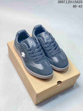 Pair of dark Descente low-top sneakers displayed on a shoe box, with the size range 40–43 shown in the image.