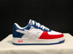 Opposite side profile showing the red toe overlay, blue heel panel, and BAPE midsole branding.