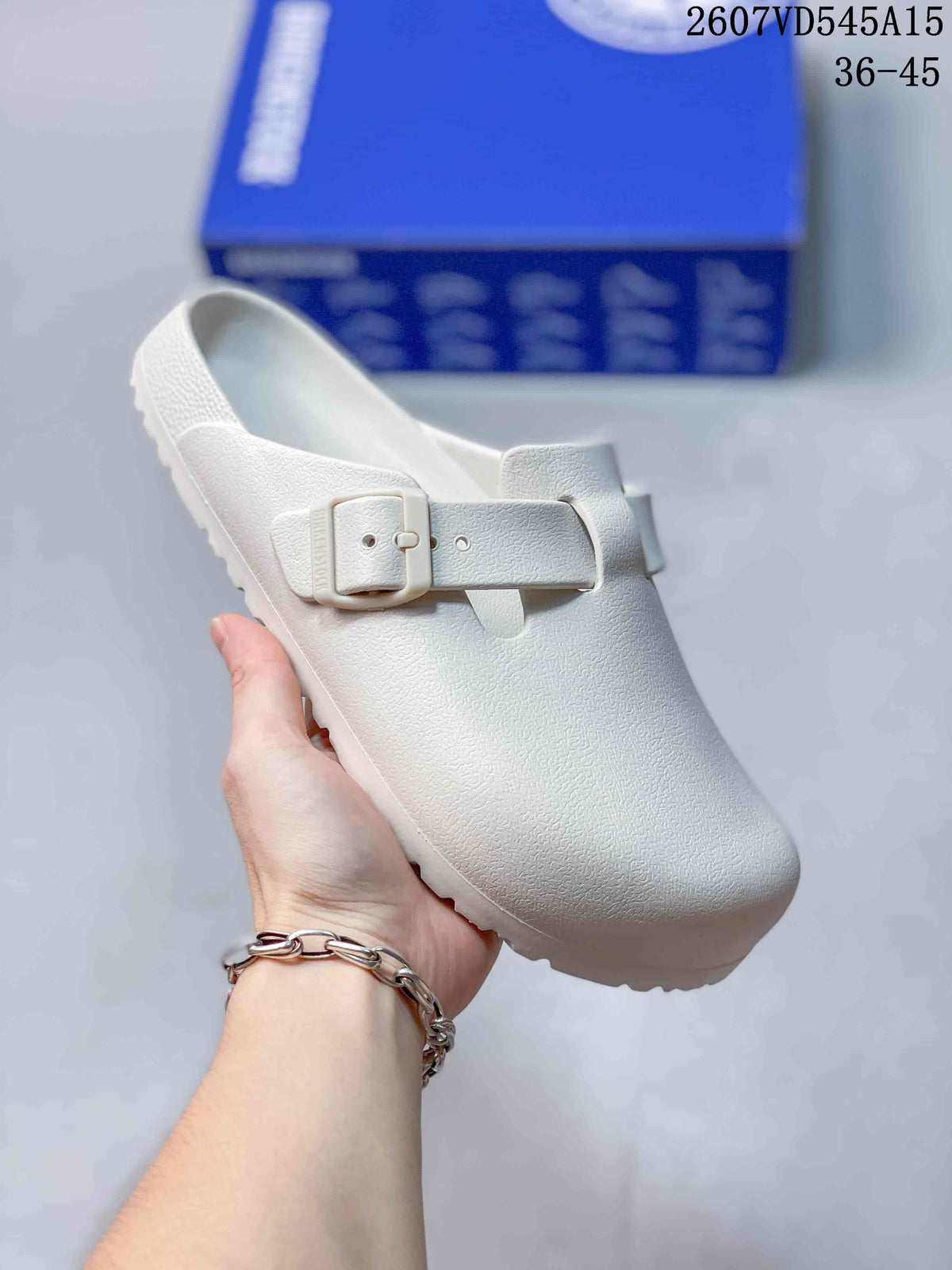 White closed-toe buckle sandal shown from an angled front view.