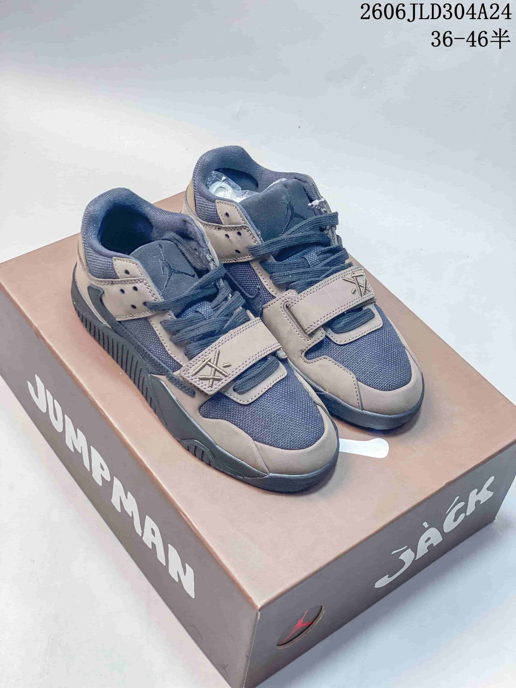 Pair of mocha and dark blue-gray Jordan Jumpman Jack low-top sneakers with forefoot straps