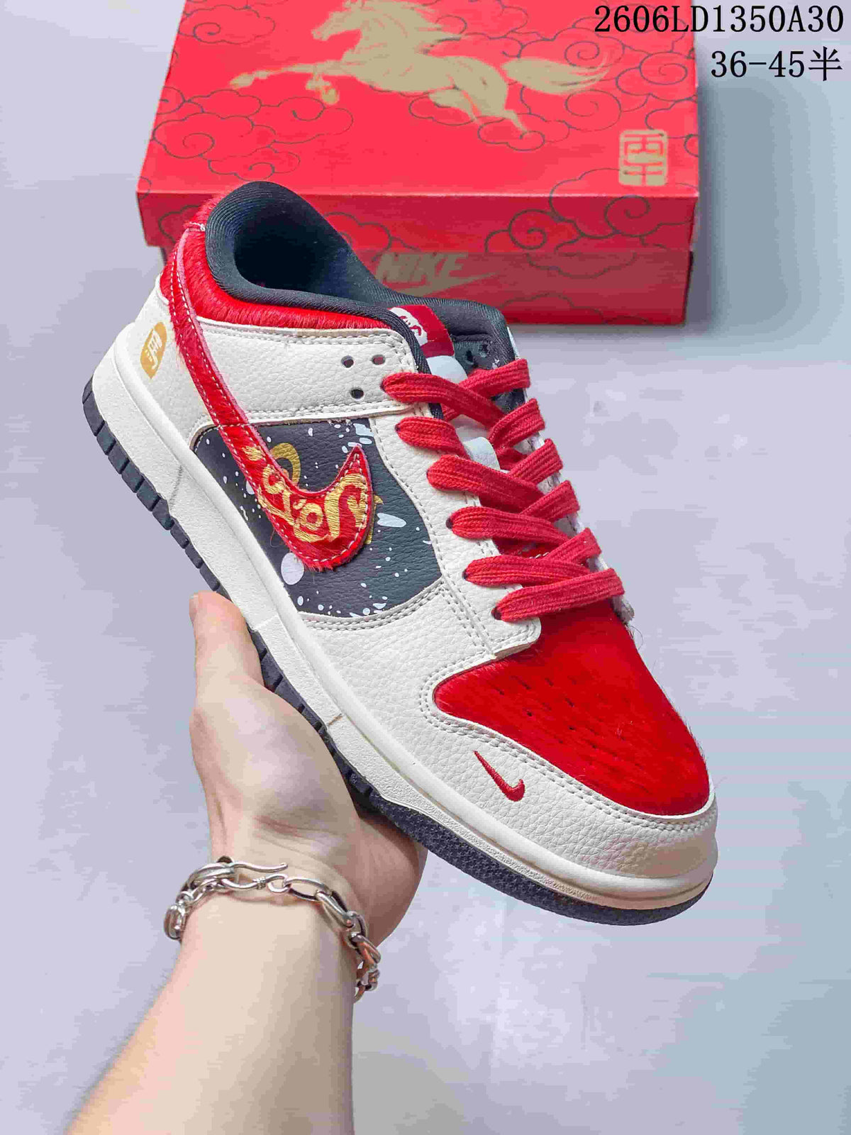 Angled side view of a red and cream Nike SB Dunk Low with horse-themed side detailing