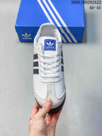 Top view of the sneaker showing white laces, a branded tongue label, and contrasting toe detailing.