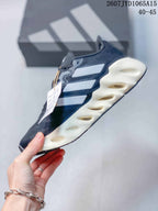 Side profile of the sneaker showing white side details, dark upper and sculpted midsole openings.