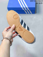 Close view of the gum-colored rubber outsole with textured tread and circular pivot detail.