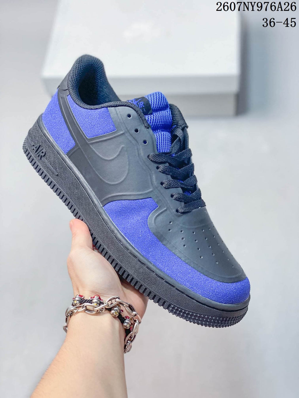 Dark gray and blue Nike Air Force 1 '07 LV8 low-top sneaker shown from the side.