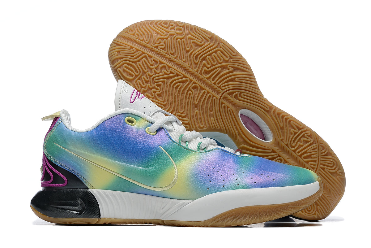 Iridescent blue, green and purple Nike basketball shoe with a gum-colored outsole.