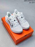 Pair of white Nike Quest 6 low-top running sneakers displayed on an orange shoe box.