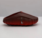 Side view of a dark red slip-on sneaker with a silver side swoosh and textured footbed.
