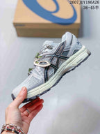 Side view of the light gray ASICS Gel-Kahana 8 FL sneaker showing the black ASICS side logo, overlays, and outsole tread.