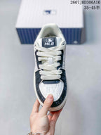 Top view of the sneaker showing white laces, navy overlays, patterned toe detailing, and the MLB tongue label.