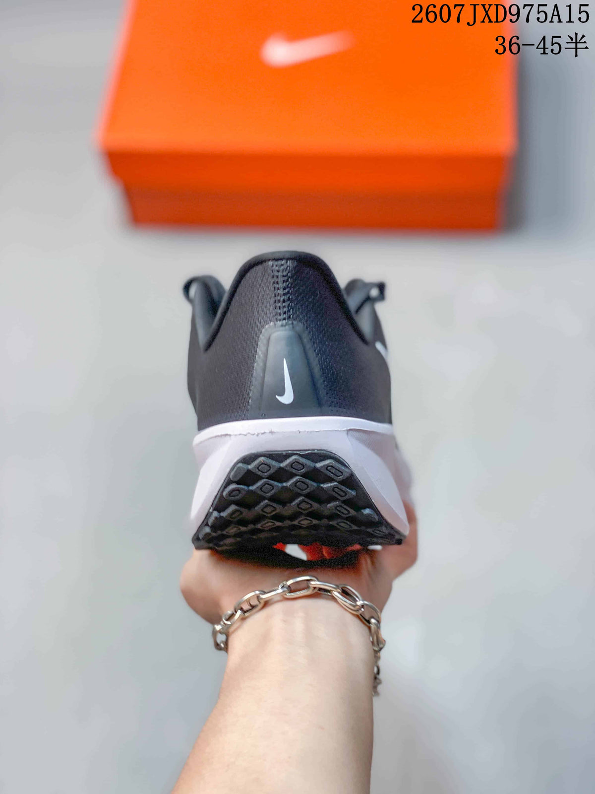 Rear view showing the padded heel, white midsole, and patterned outsole.
