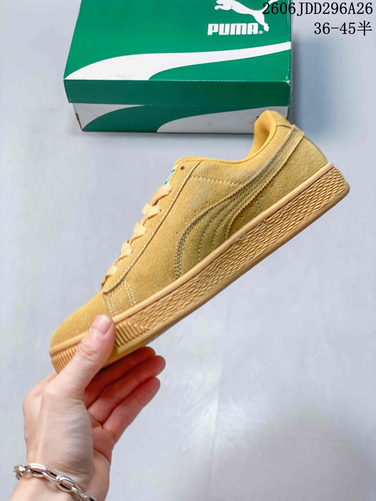 Side profile of the wheat sneaker showing the low-top shape, side formstrip, lace-up construction and textured sole edge.