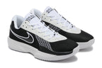 Angled view of the black and white Nike G.T. Cut Academy shoe pair.