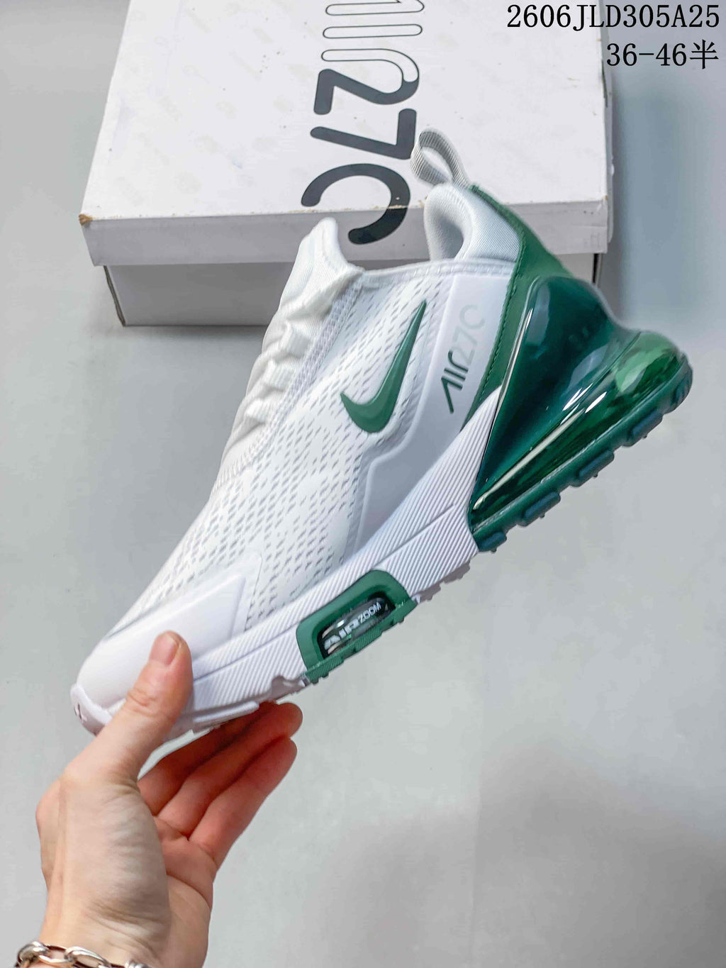 Side view of the white and green Nike Air Max 270 Premium sneaker