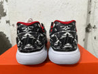 Rear view of black-and-white patterned Nike shoes with red trim and white soles