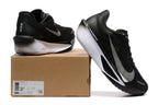 Black Nike Zoom Fly 6 shoes with white details beside a box showing a sample size label