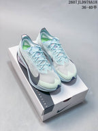 Pair of pale blue Nike running sneakers displayed on a Nike shoebox, with style code 2607JLD978A18 and size range 36–40.5 visible in the upper right.