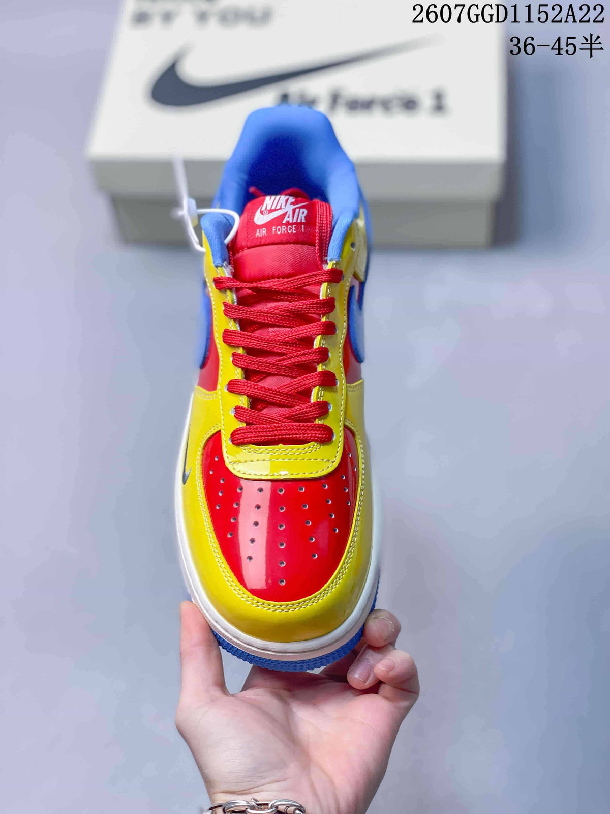 Top view showing the red perforated toe box, yellow overlays, and red laces.