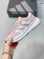 Side view of the pink sneaker with white side stripes, a white sculpted midsole and dark outsole edge.