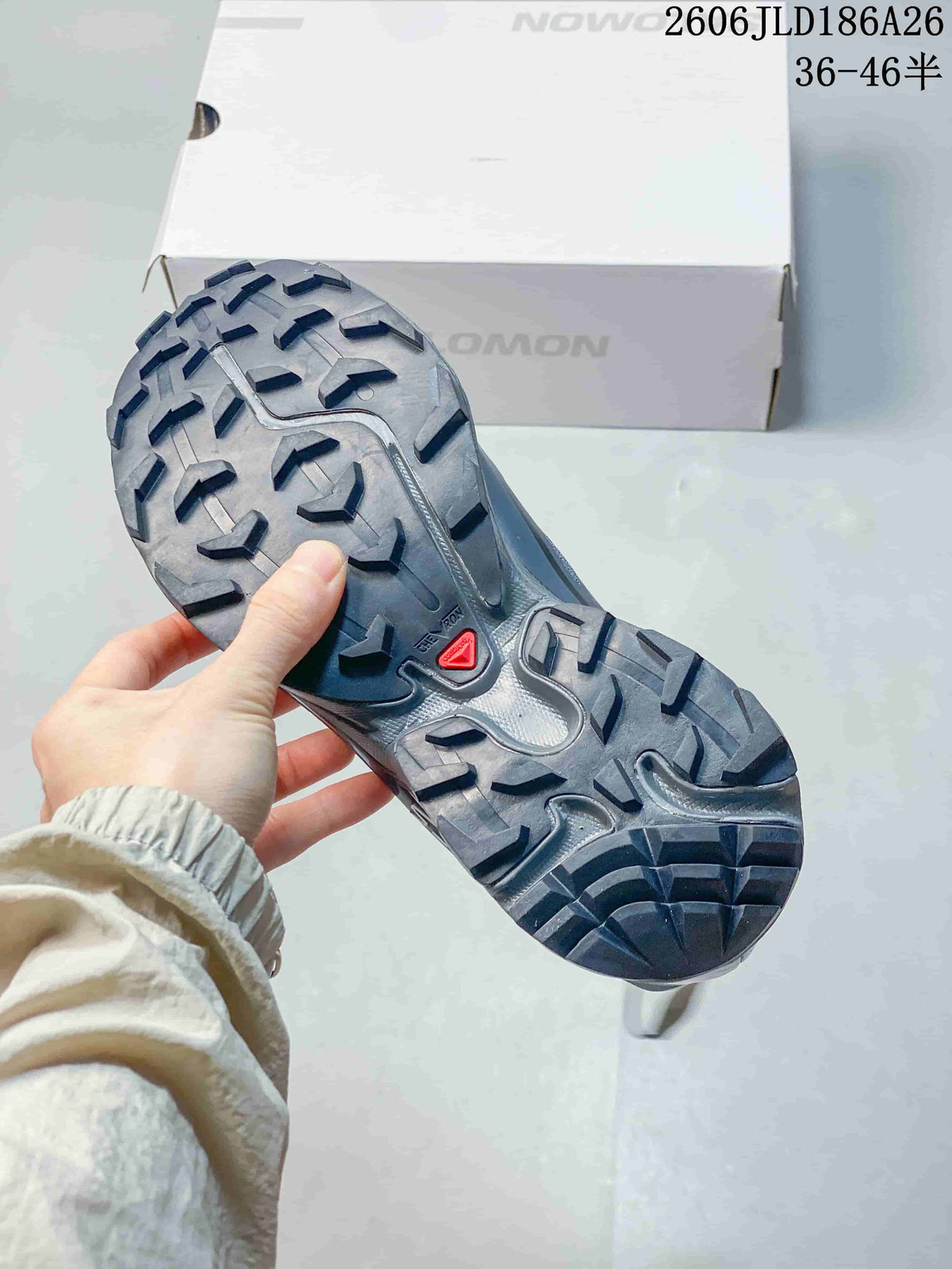 Close-up of the gray shoe outsole with deep, angular tread lugs