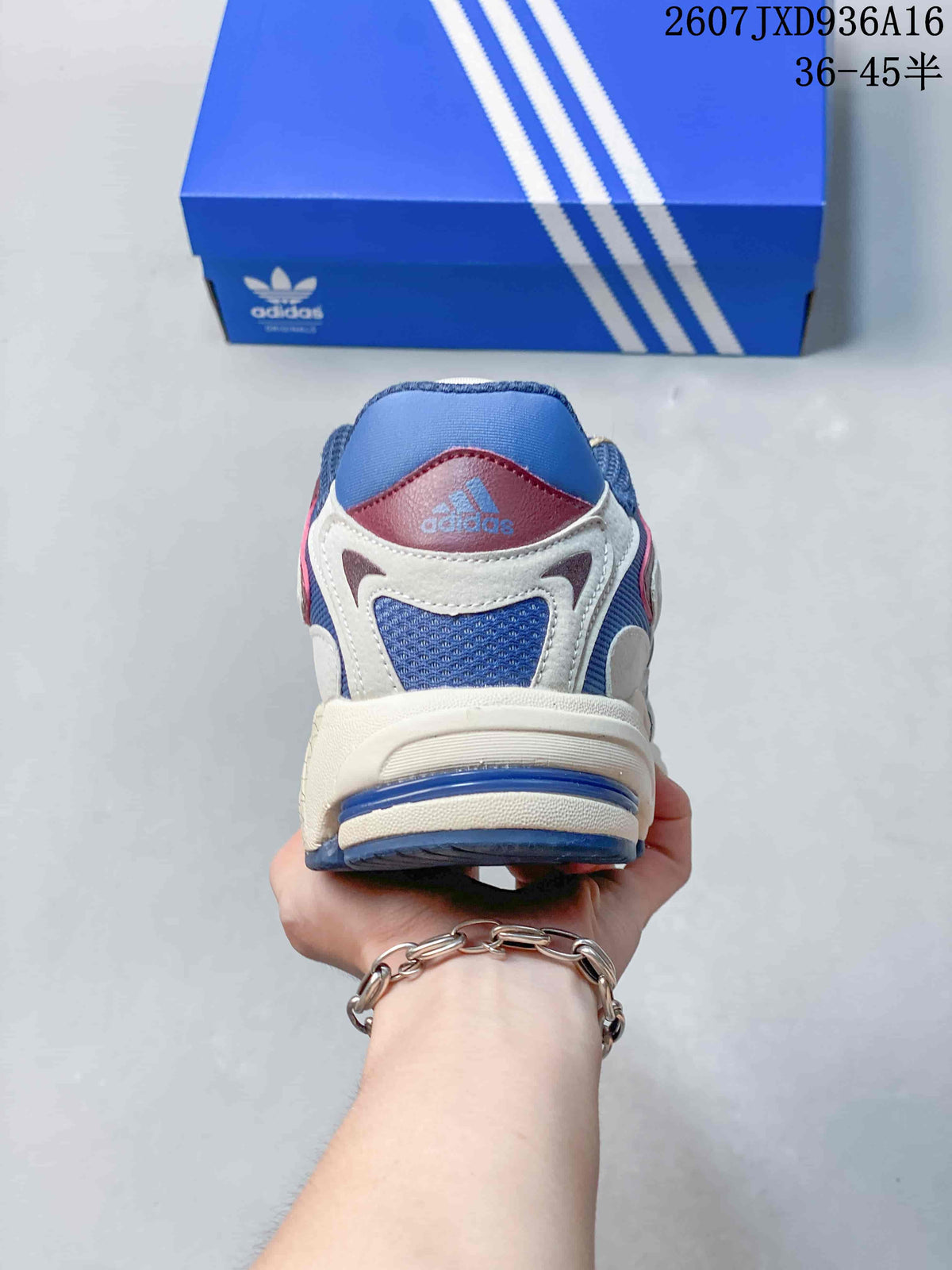 Rear view of the sneaker showing the padded blue collar, cream heel overlays and adidas branding.