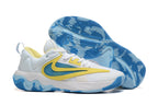 White basketball shoe with yellow and blue accents