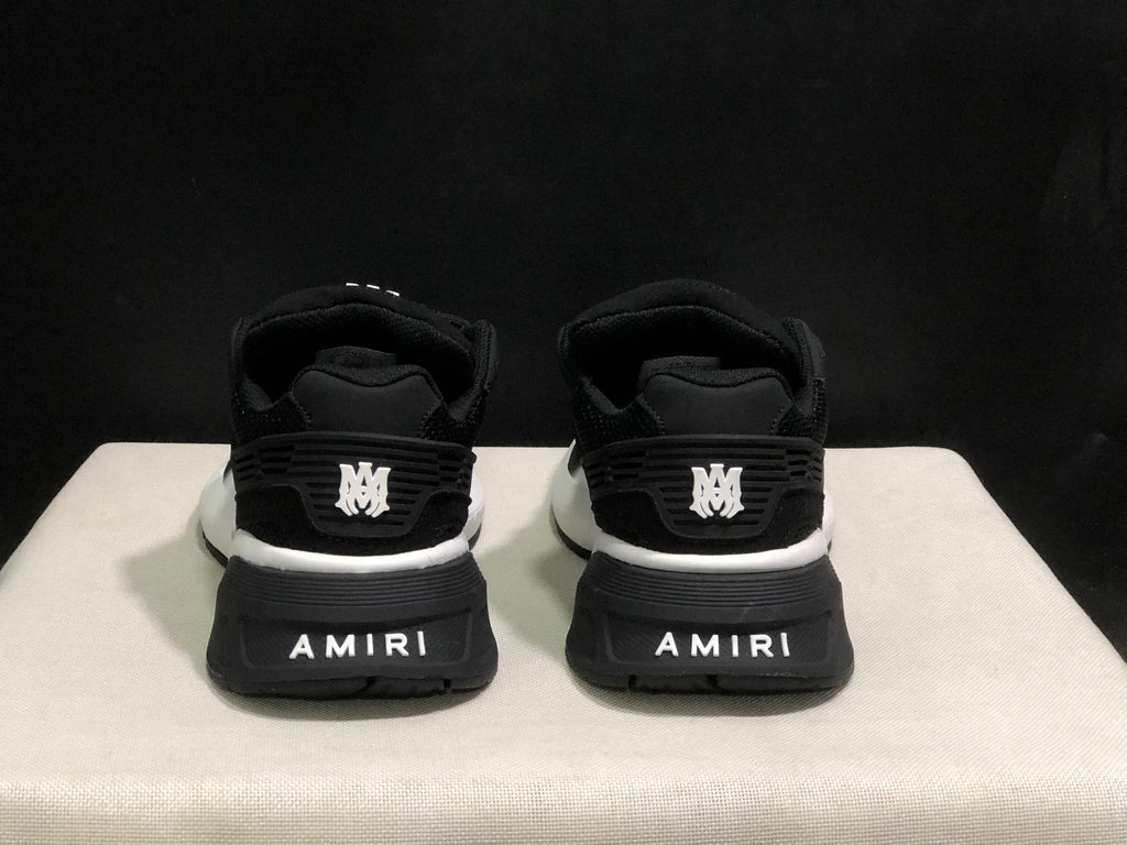 Rear view highlighting the padded heels, layered heel details, and AMIRI branding.