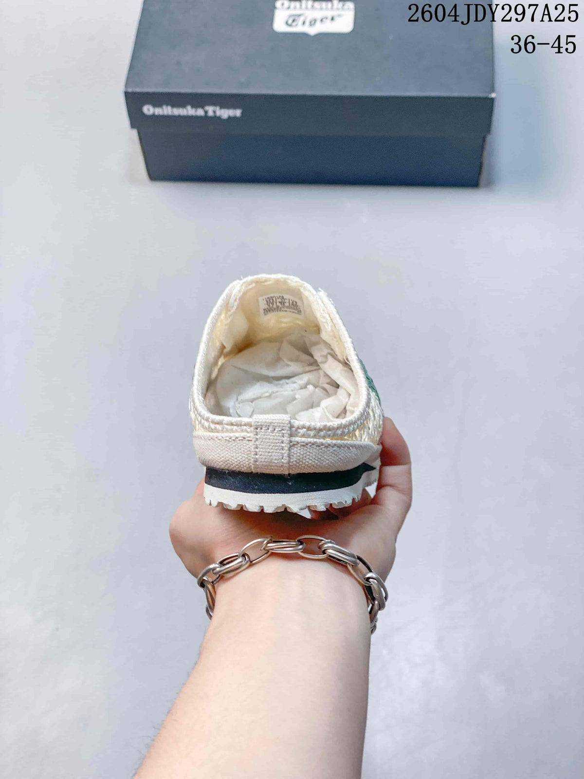 Rear view showing the open heel, layered sole, and tread edge of the cream slip-on sneaker.