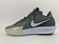 Side view of a dark gray Nike basketball shoe with a white Swoosh, pale forefoot section, and ZoomX midsole marking